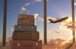 travel bags and airplane in sky